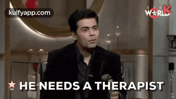 a man in a suit says he needs a therapist while sitting in front of a mirror .
