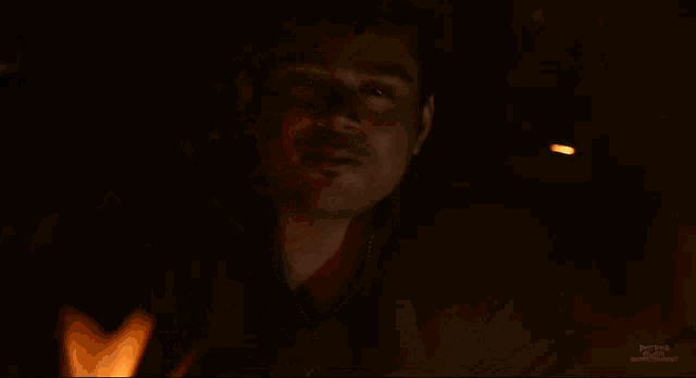 a man stands in front of a fire with the words you act very well you can try in movies
