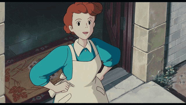 a woman with red hair is wearing an apron