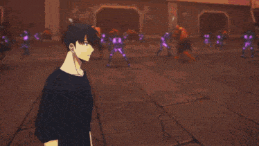 a man in a black shirt is standing in front of a wall with candles on it