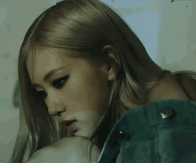 a close up of a woman with blonde hair