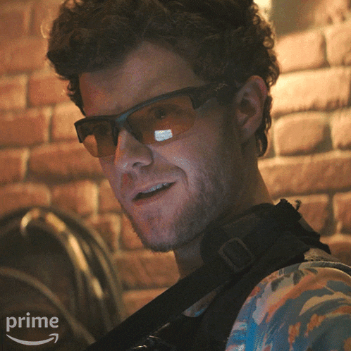 a man wearing sunglasses and a floral shirt is on a prime video