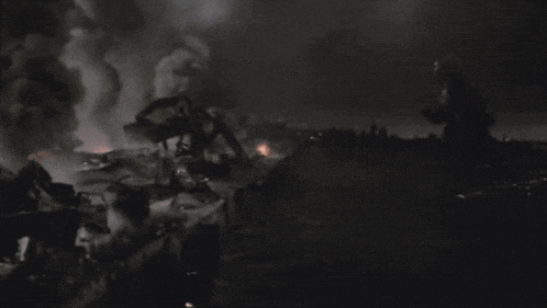 a dark scene with a lot of smoke coming out of the ground