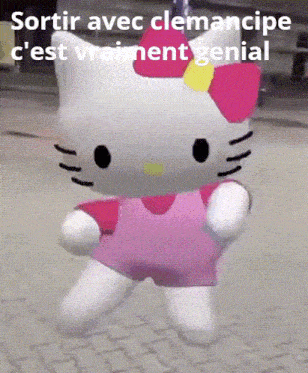 a hello kitty doll is standing on a sidewalk with a caption in french