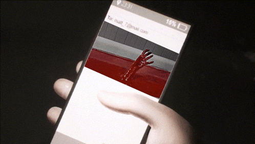 a hand is holding a cell phone with a bloody hand coming out of the screen