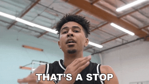 a basketball player says that 's a stop while standing in a gym