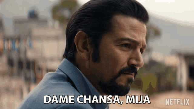 a man with a beard says " dame chasa mija "
