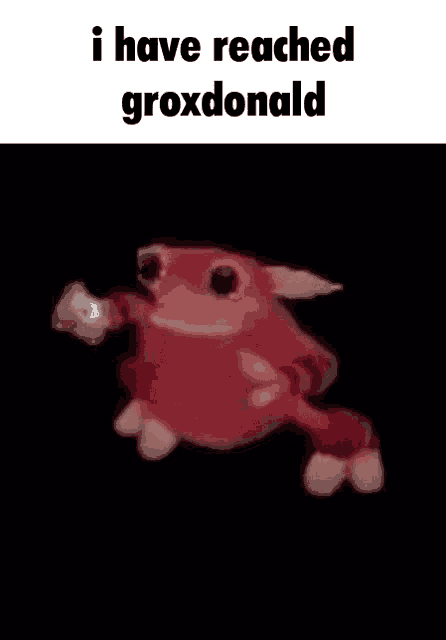 a red frog is dancing in the dark with the words `` i have reached groxdonald '' written above it .