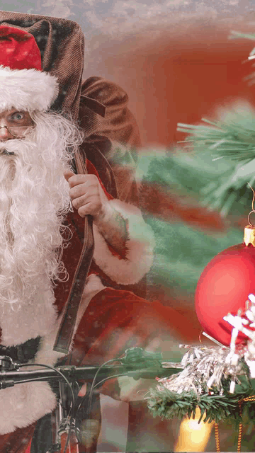 a man dressed as santa claus is riding a bicycle
