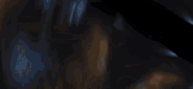 a blurry picture of a person with red eyes and a subscribe button on the bottom