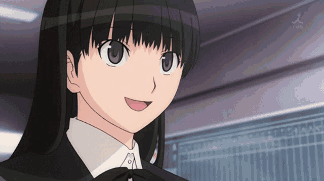 a girl with black hair and a bow tie is smiling
