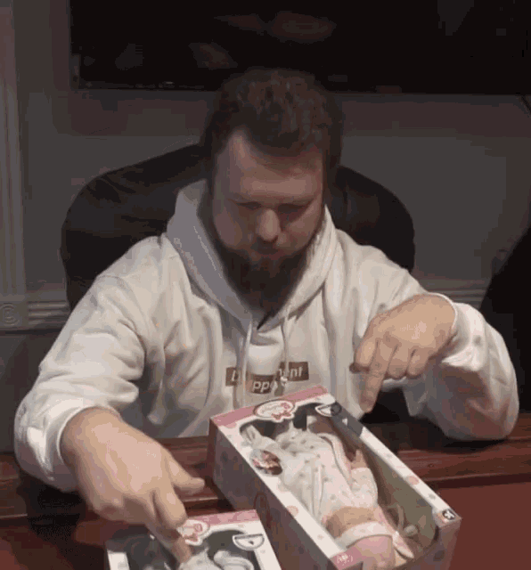 a man wearing a white hoodie that says supreme