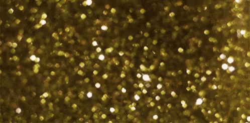 a close up of a gold glitter texture