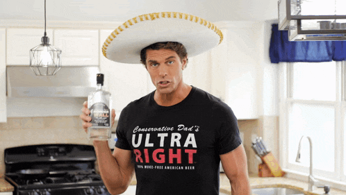a man wearing a sombrero is holding a bottle of ultra right beer