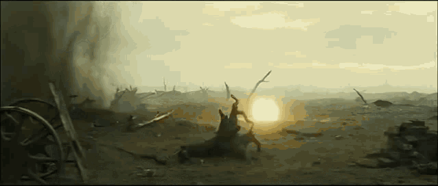 the sun is shining through the clouds in the middle of a battlefield .