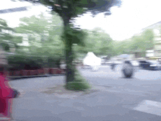 a blurry photo of a person walking down a street