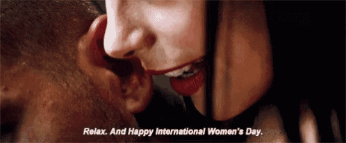 a woman is whispering into a man 's ear and says `` relax and happy international women 's day ''