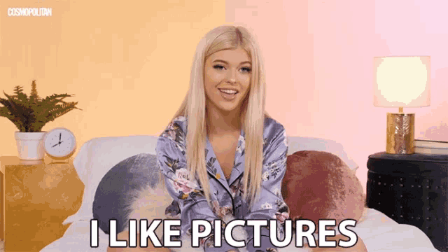 a woman sitting on a bed with the words i like pictures