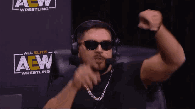 a man wearing sunglasses and a headset says " don 't interrupt my dance mark "