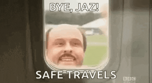 a bald man with a mustache is looking out of a plane window .