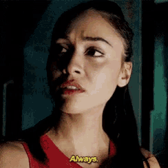 a close up of a woman 's face with the words `` always '' written on it .