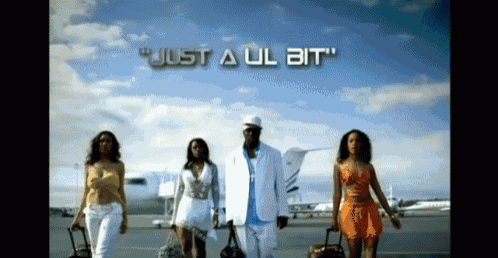 a group of people walking on a runway with the words just a ul bit