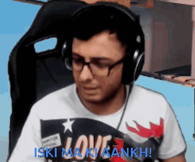 a man wearing headphones and a shirt that says ' love '