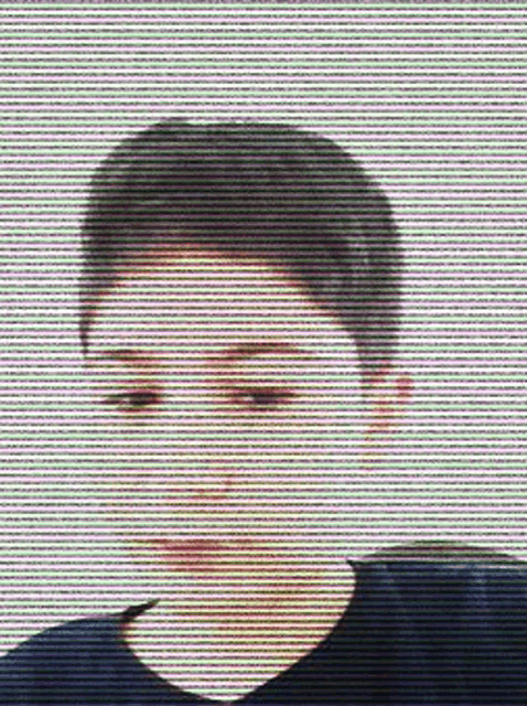 a close up of a person 's face with a striped background behind it .
