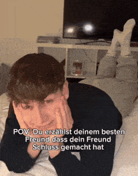 a man laying on a bed with a caption that says pov du erzählst deinem besten freund