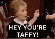a judge is sitting at a table giving a thumbs up and says `` hey you 're taffy ! ''