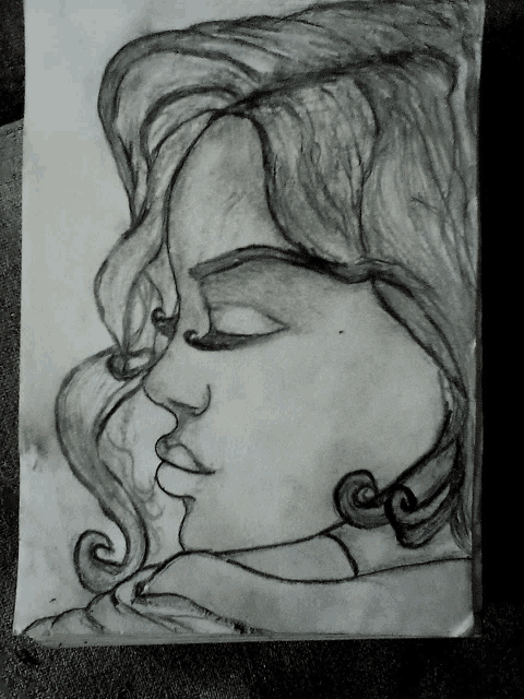 a black and white drawing of a woman 's face