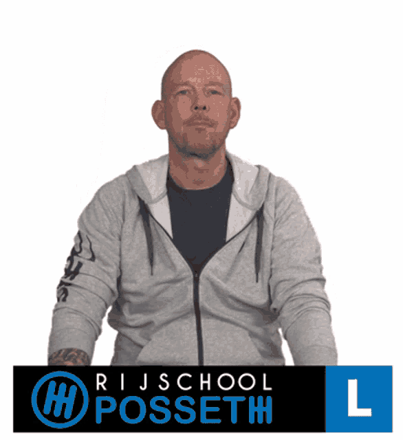 a man in a grey hoodie stands in front of a sign that says rijschool h posseth