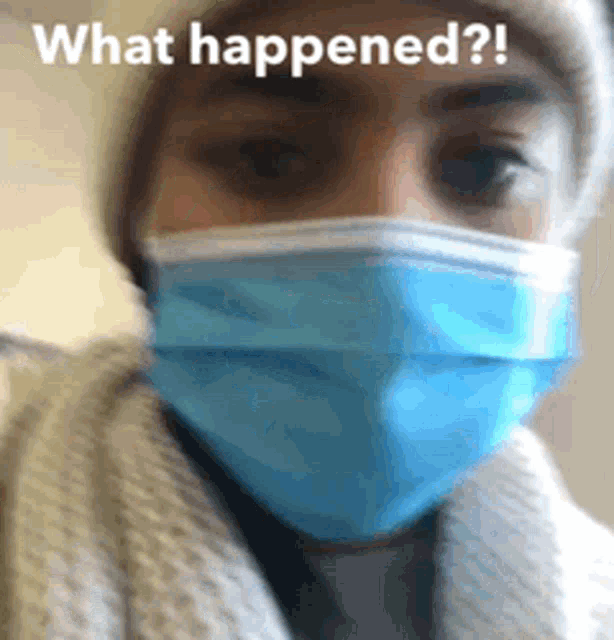 a woman wearing a blue face mask with the words what happened written above her