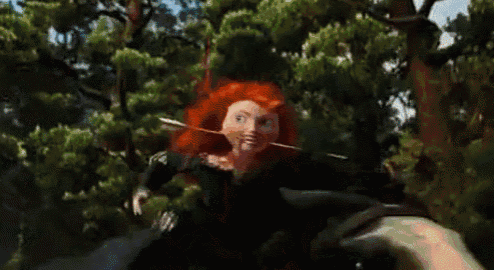 a woman with red hair and green eyes is holding a bow and arrow in her mouth