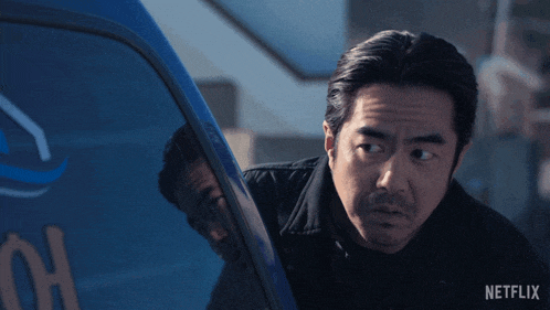a man looking out of a car window with a netflix logo on the bottom