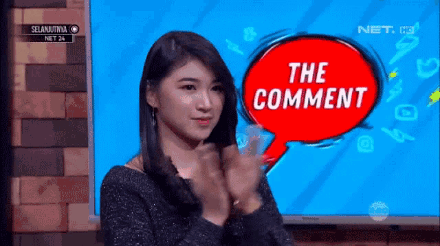 a woman applauds in front of a red speech bubble that says the comment