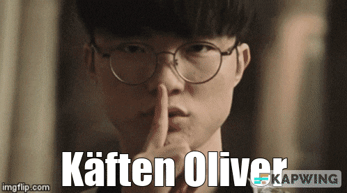 a man wearing glasses holds his finger to his mouth and says " kaffen oliver "