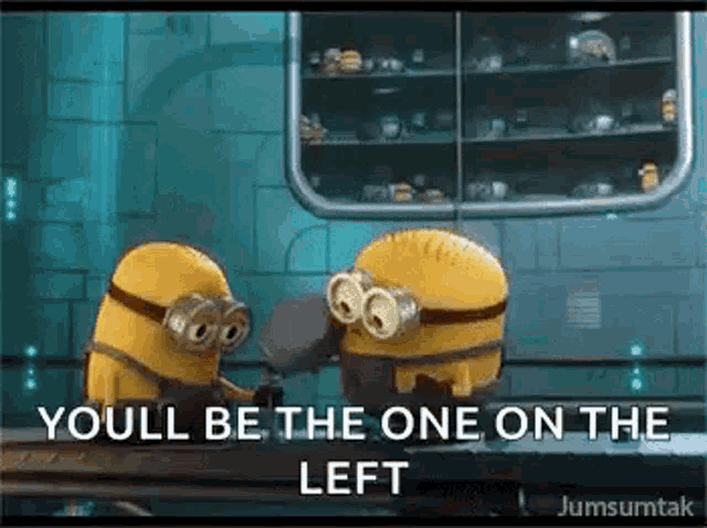 two minions are standing next to each other and one of them is holding a hammer .
