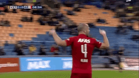 a man wearing a red afas jersey with the number 4 on the back
