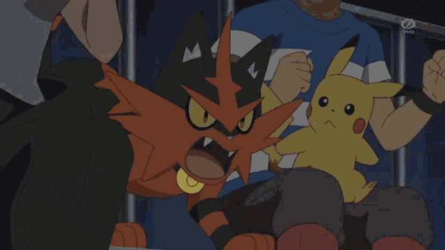 a pikachu is being held by a man in a blue and white shirt