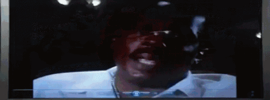 a tv screen shows a man named deacon jones on it
