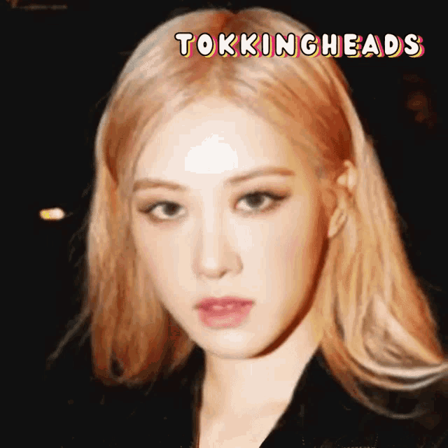 a close up of a woman 's face with the words " tokingheads " above her