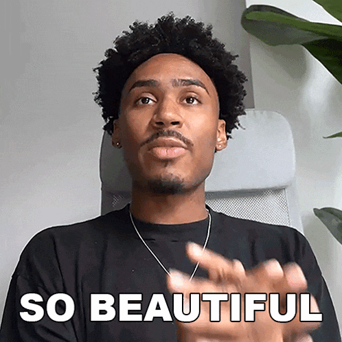 a man with curly hair is sitting in a chair with the words so beautiful written above him
