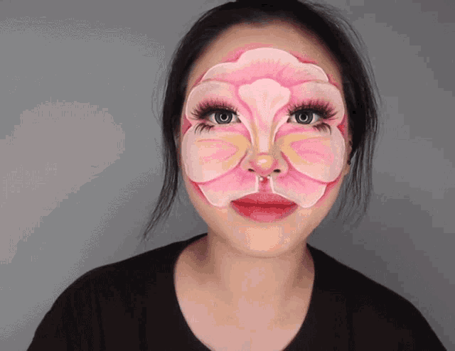 a woman with her face painted like a flower