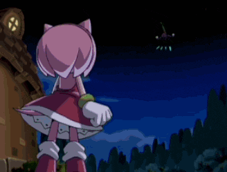 amy rose from sonic the hedgehog is standing in front of a fire