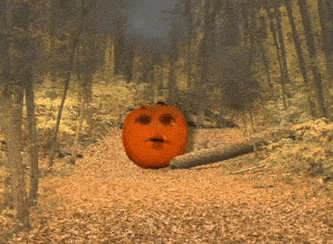 a pumpkin with a face on it is walking through a forest