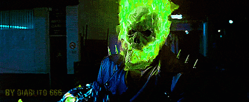 a ghost rider with a glowing green skull on his head