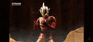 a cartoon character from ultraman official is standing in front of some rocks