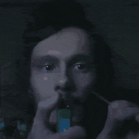 a close up of a person lighting a candle