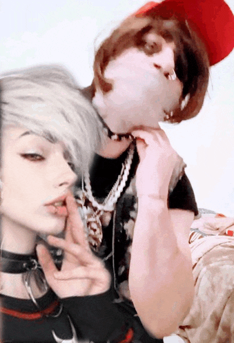 a man and a woman are posing for a picture and the woman has a piercing in her lip